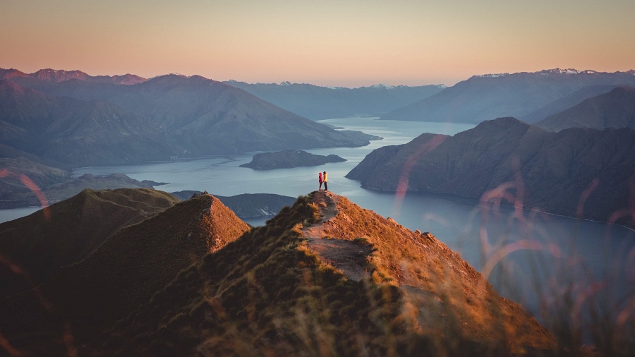 a couple on the top of mountain